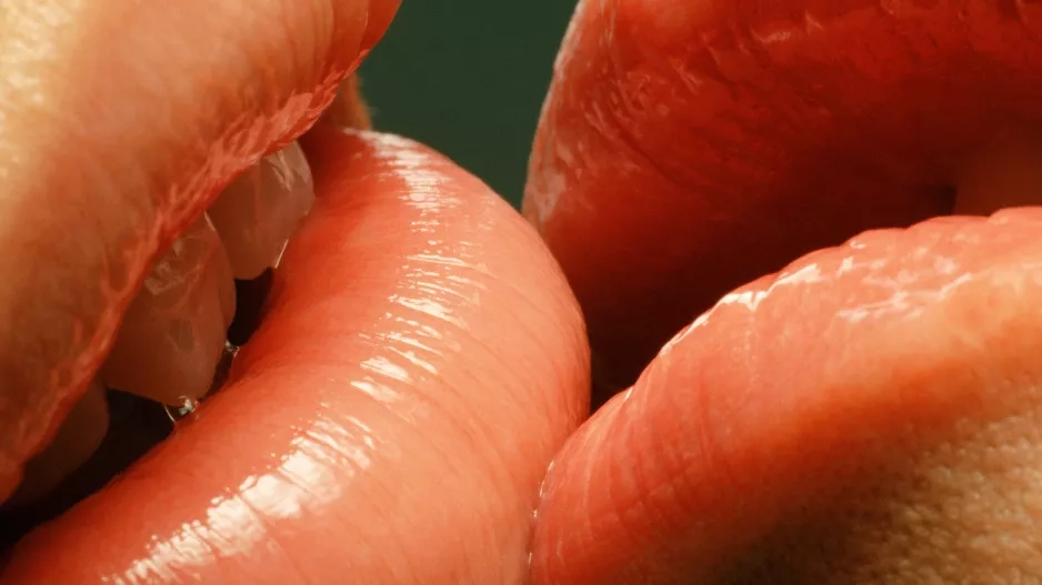 Couple with glossy lips kissing