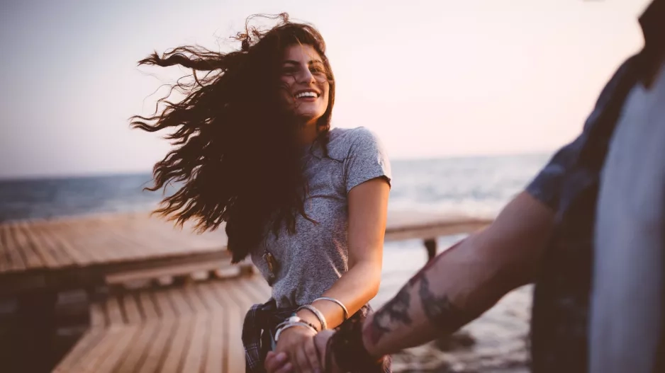 Young playful hipster couple