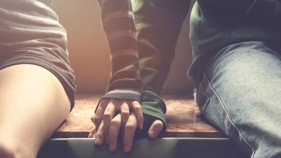 Young couple holding hands