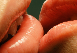 Couple with glossy lips kissing
